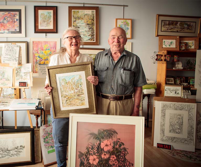 Couple surrounded by artwork